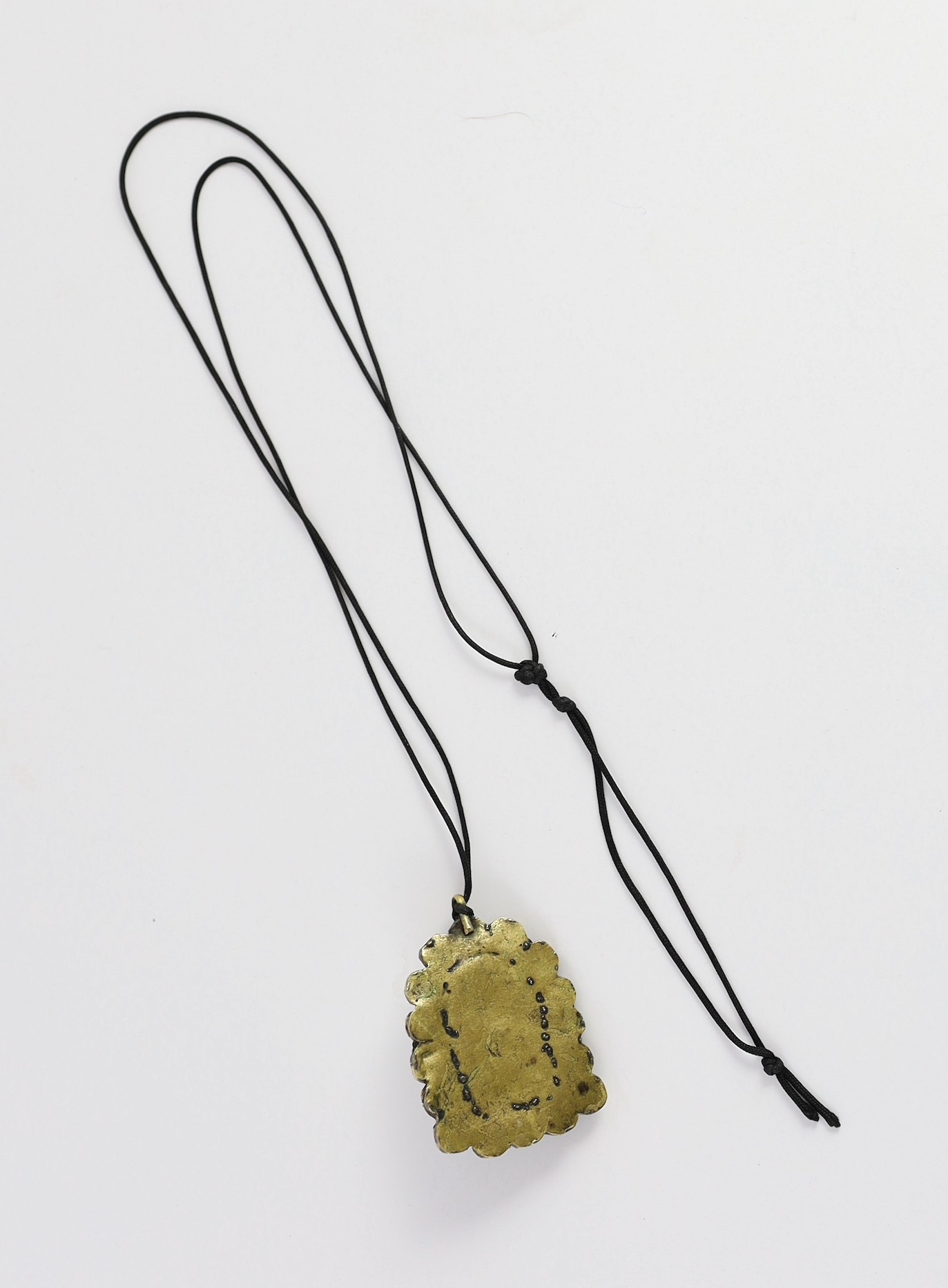 A Tibetan rock crystal and gem set pendant, 19th century, 5.8cm including suspension loop, slight damage
